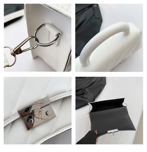 Détails d'un sac à main blanc matelassé avec fermoir carré et finitions argentées