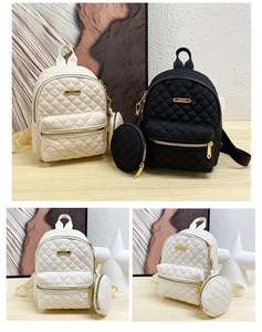 Detail of quilted diamond pattern on oxford fabric backpack with round coin pouch