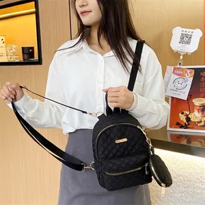 Chic black quilted diamond pattern oxford backpack with a matching mini coin purse