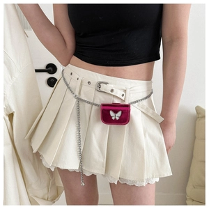 Detail of rose pink velvet mini bag with white butterfly and silver metal waist chain