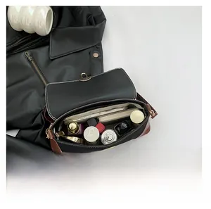 French baguette bag interior showing large capacity for phone, perfume and cosmetics