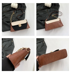 Detail of retro tricolor shoulder bag with crocodile pattern and golden metal lock