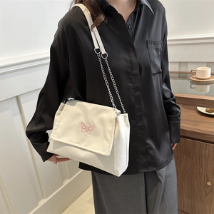 White canvas shoulder bag with pink butterfly embroidery and elegant chain strap