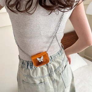 Orange metallic mini crossbody bag with a white butterfly ornament and silver chain strap