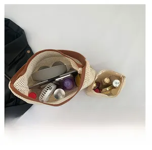 Mesh woven tote bag interior showing large capacity for headphones and daily items