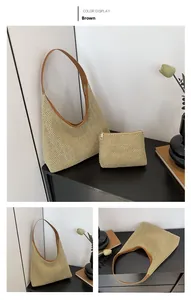 Detail of woven straw hobo tote bag set with brown leather straps and matching pouch