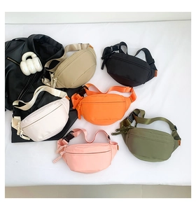 Detail view of nylon chest bags in six vibrant colors including beige, orange and green