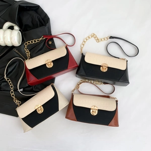 Luxury color-block baguette bag with crocodile texture flap and gold metal chain strap