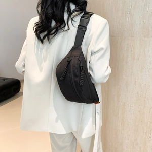Versatile black nylon crossbody chest bag with adjustable strap and dual zipper closure