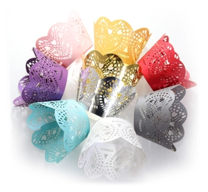 Laser-cut cupcake wrappers with heart lace patterns in various vibrant colors