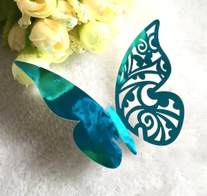 3D hollow butterfly wall sticker with blue laser holographic finish on white fur background