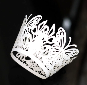 Elegant white laser-cut butterfly cupcake wrappers for wedding dessert table decoration