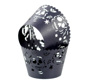 Laser cut black cupcake wrappers with skull patterns for Halloween and party decor