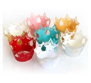 Laser-cut cupcake wrappers with crown and star patterns in seven assorted metallic colors