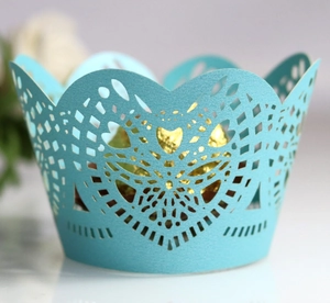 Light blue laser cut cupcake wrappers with hollow heart pattern for wedding party decoration