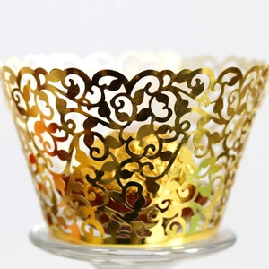 Elegant gold laser cut cupcake wrapper with vine patterns for wedding table decoration