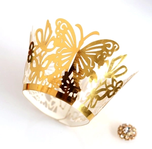 Golden laser-cut butterfly lace cupcake wrapper with intricate floral hollow design