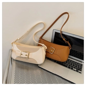 Minimalist vintage baguette bags in cream and caramel leather with gold buckles