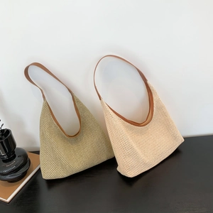 Minimalist woven tote bags in green and beige colors with brown leather handles