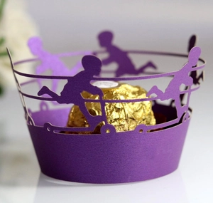 Purple laser cut cupcake wrapper with silhouette of children playing for party favors