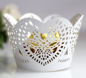 White laser cut heart lace cupcake wrappers with elegant hollowed floral design