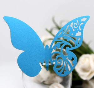 Detail of blue laser-cut butterfly cup card with intricate hollow wing design and slot