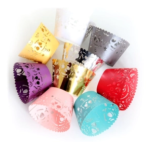 Laser-cut Halloween cupcake wrappers featuring skull patterns in multiple vibrant colors