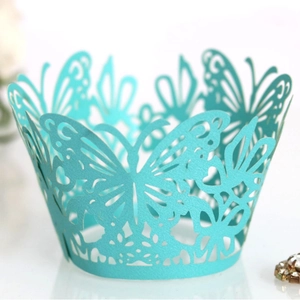Elegant light blue laser-cut cupcake wrappers with delicate butterfly patterns for weddings
