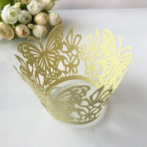 Pale yellow laser-cut butterfly cupcake wrappers made of premium pearlescent paper