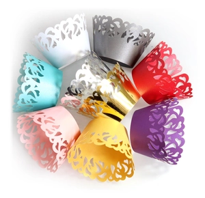 Various colors of laser-cut heart pattern lace cupcake wrappers for weddings