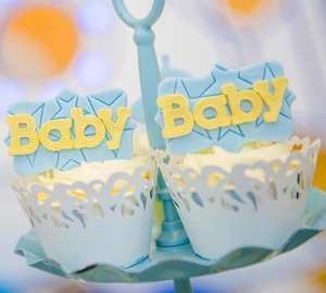Detailed laser-cut heart pattern cupcake wrapper and Baby star topper for baby shower