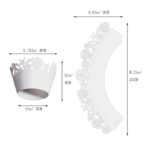 Detailed view of laser-cut cupcake wrapper with white seashell and starfish hollow design