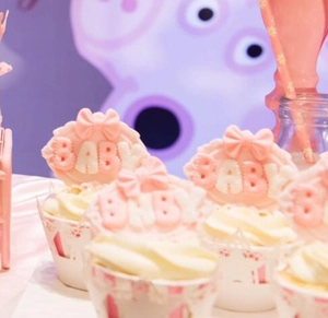 Baby shower cupcake wrappers with hollow lace design and pink star baby toppers