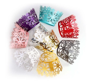 Laser-cut floral cupcake wrappers set in nine various metallic and matte colors