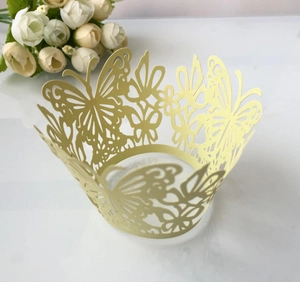 Elegant gold laser cut butterfly cupcake wrappers for wedding and party decorations