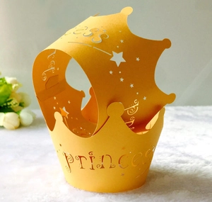 Detailed laser cut pink crown paper cupcake wrapper featuring hollow Princess text design