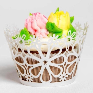 White laser-cut floral lace cupcake wrappers for wedding cake decoration