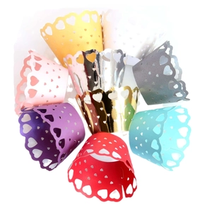 Laser cut heart cupcake wrappers in assorted pearlescent colors for wedding parties