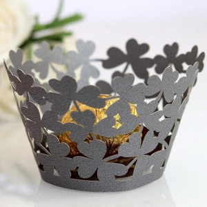 Laser cut dark grey cupcake wrappers with clover hollow design for elegant party decor