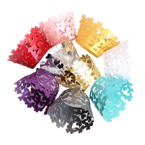 Laser-cut cupcake wrappers with heart floral patterns in multiple metallic colors