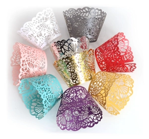 Laser-cut butterfly hollow cupcake wrappers in colorful pearlescent paper for wedding decor