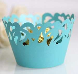Close-up of Tiffany blue laser-cut heart cupcake wrapper with elegant lace details