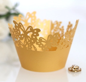 Hollow butterfly laser cut cupcake wrappers in champagne gold pearlescent paper