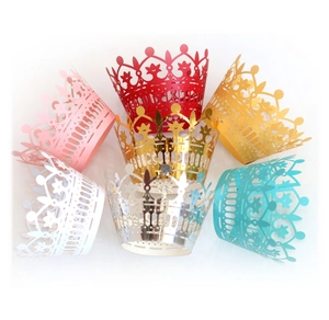 Laser-cut crown cupcake wrappers in multiple colors including gold, pink, and red