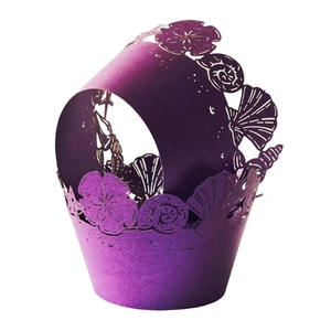 Purple laser cut cupcake wrappers with seashell and coral ocean theme patterns