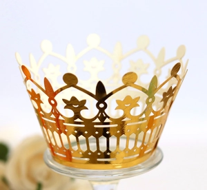 Detailed laser-cut hollow crown design in metallic gold for wedding cupcake liners