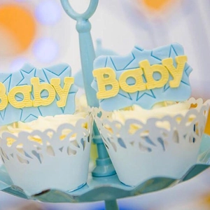 Light blue hollow laser-cut cupcake wrappers and Baby toppers for baby shower party decor