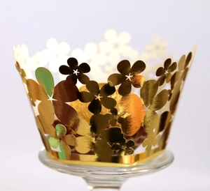 Laser cut hollow flower cupcake wrappers in mirror gold finish for wedding decor