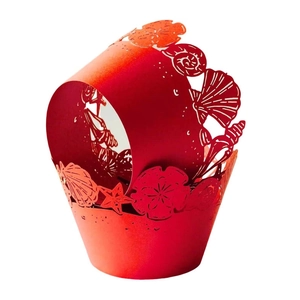 Pink laser-cut cupcake wrappers with ocean sea shell and starfish cutout patterns
