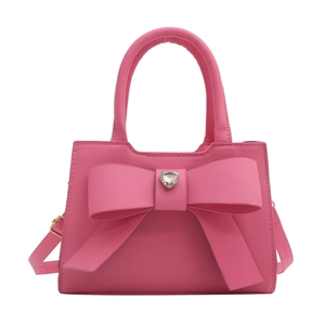 Borsa rosa minimalista con grande fiocco e strass a forma di cuore brillante